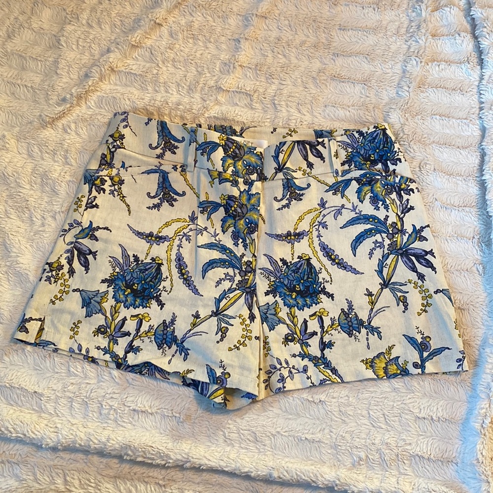 Loft shorts, size 8, cream with blue and yellow flower design. Pockets in front.